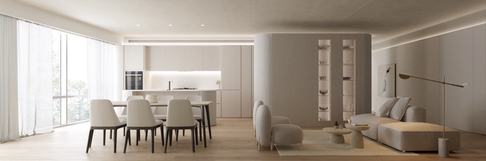 Living, comedor y cocina integrados, con un volumen curvo estriado que separa los sectores